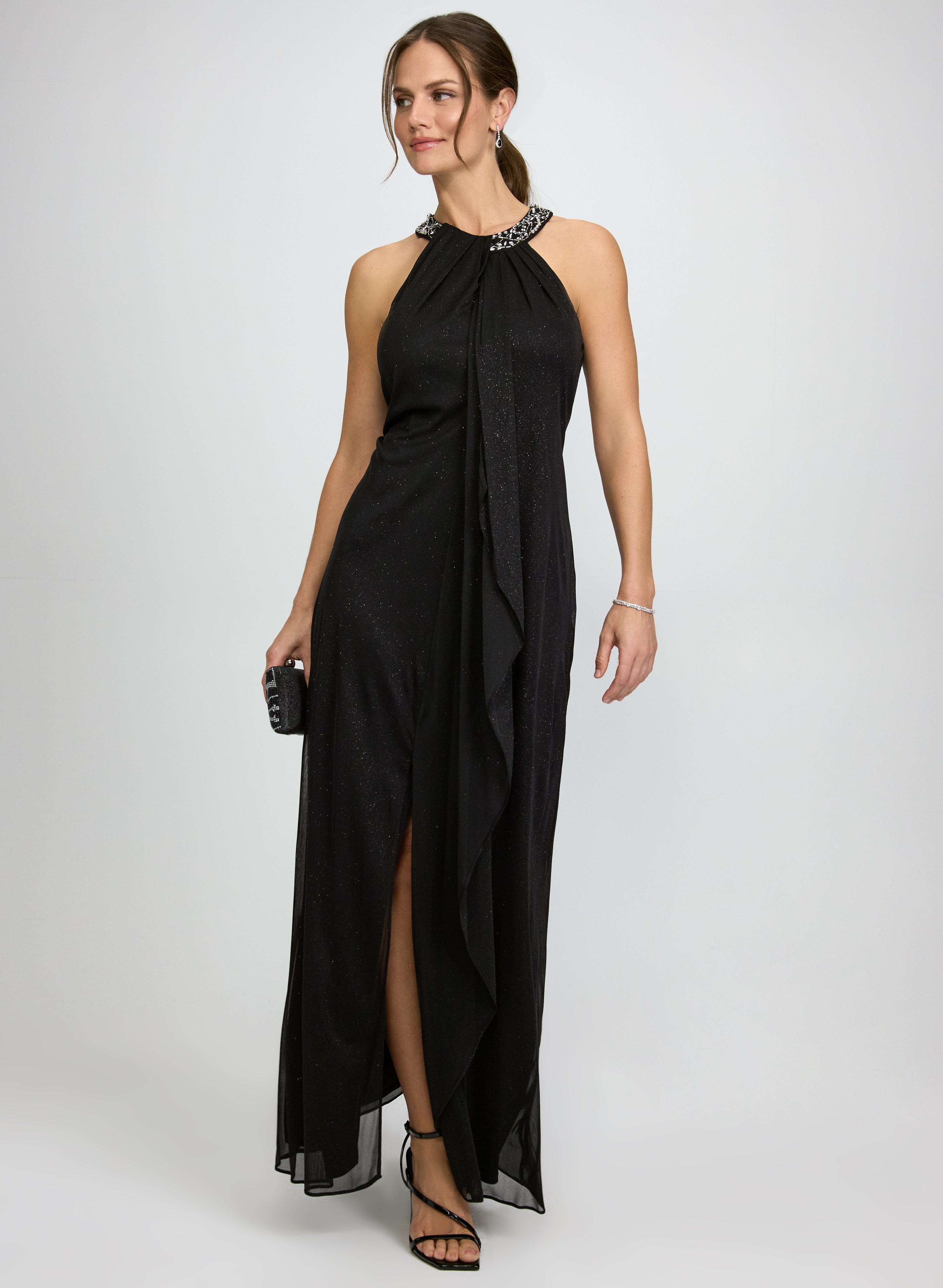 black glitter halter neck dress and an a